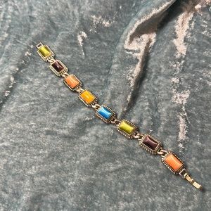 Multicolored bracelet with tiger eye style stone